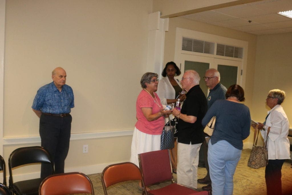 District 3 Commissioner JoAnn Birrell talks with constituents after the town hall (photo by Larry Felton Johnson)