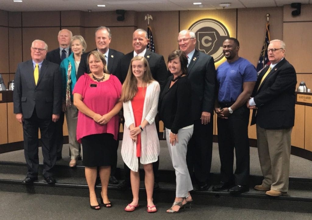 Isabella Parker (white cardigan) of Harrison High was recognized for her invention which is now in the patent process. (photo by Rebecca Gaunt)