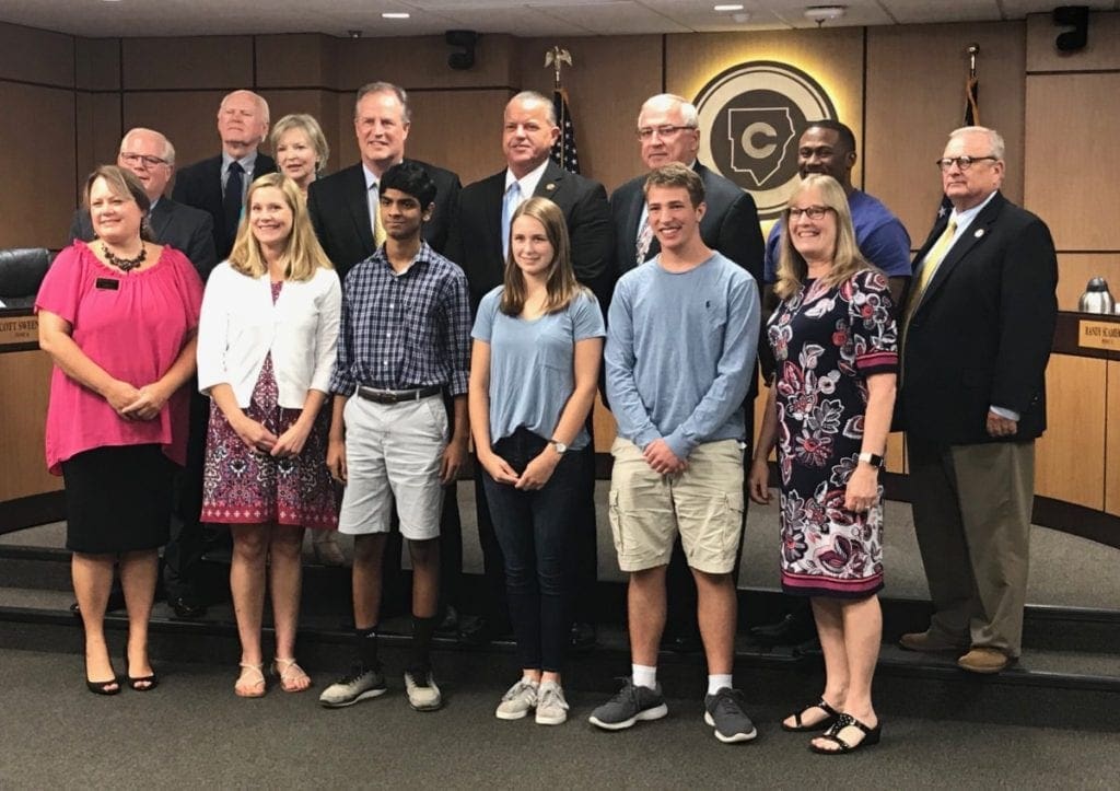 Rishab Rao, Noah Buckner and Alexandra Holdemeyer of Walton High were recognized for their fire safety invention. (photo by Rebecca Gaunt)