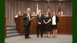 Chairman Michael Boyce reads proclamation to DUI court judge and coordinators