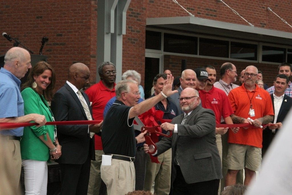 City of Acworth Mayor Tommy Allegood and Cobb County Support Services Director Eddie Canon cutting the ribbon on the Acworth Community Center (photo by Alex Patton)