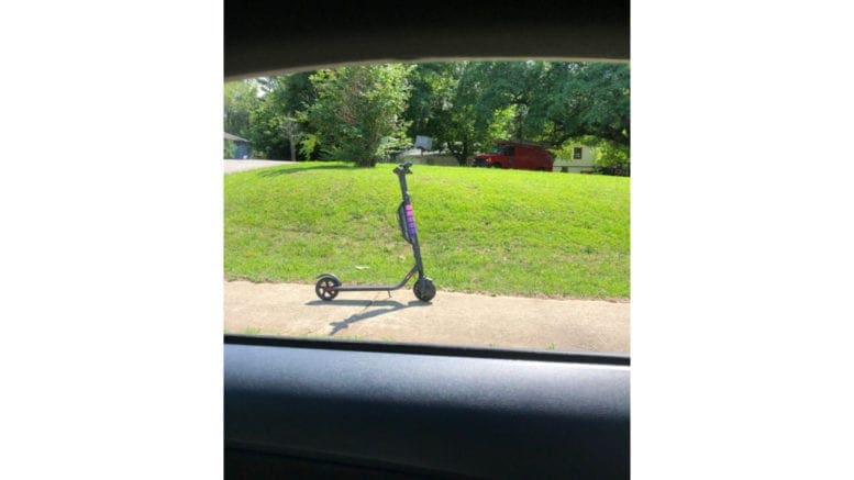 Electiric scooter on a sidewalk accompanying article about Smyrna's electric scooter ban