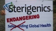 sign held at Sterigenics protest with the Sterigenics slogan "Safeguarding Global Heath" changed to "Endangering Global Health"
