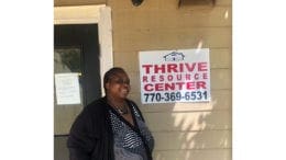 Cobb District 4 candidate Monica DeLancy stands in front of the Thrive Resources Center in Austell, Georgia at Kingsley Village Park Apartments. DeLancy founded “We Thrive” to empower renters through the education of their rights and advocacy.