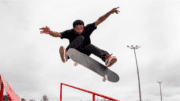 Man in mid-air on skateboard for Kennesaw Go Skateboarding celebration