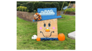 Box-shaped scarecrow wearing a hat with the Kennesaw logo