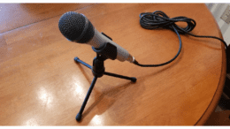 Microphone on a tripod on a wooden table