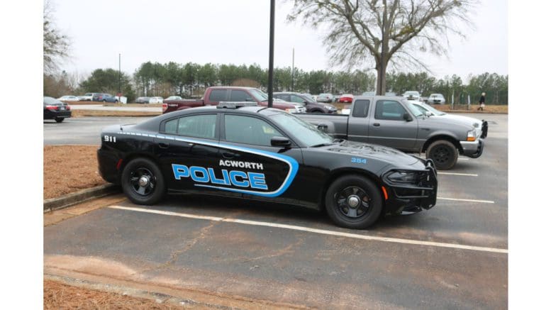An Acworth police car in a parking lot