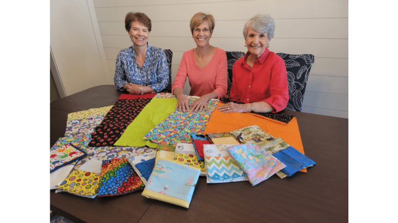 left to right Meredith Mask - community service chair, Judy Weathers - past president and Linda Bailey – president of East Cobb Quilters’ Guild shown with some of the 436 pillowcases that they donated for Ryan’s Case for Smiles to children in hospitals in Atlanta and throughout the state.