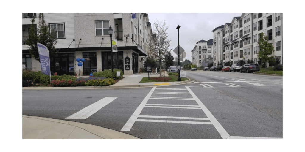 The retail corner of the Eddy at Riverview Landing.with crosswalks and outdoor tables