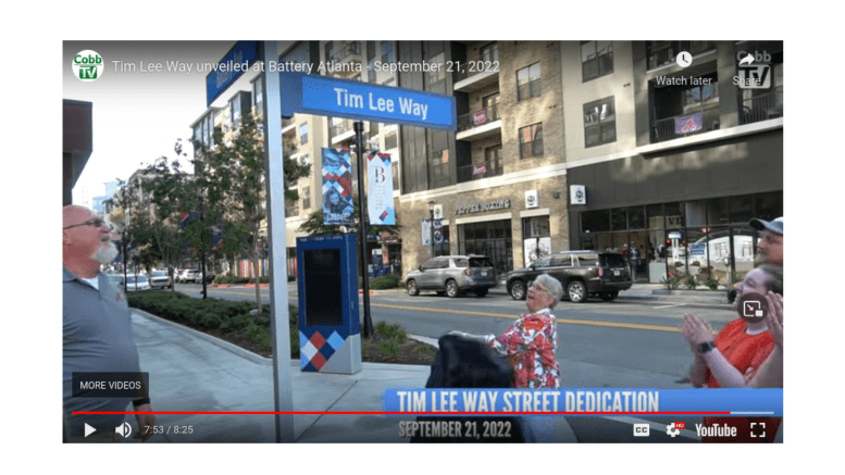 Screenshot of Tim Lee's wife Annette Lee unveiling the street sign commemorating former BOC Chairman Lee