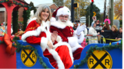 Santa and woman on parade float