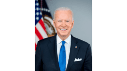The official photo of President Joe Biden, in suit with tie in front of U.S. flag