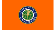 Flag of the Federal Aviation Administration, and orange flag with a logo encircling a globe with wings