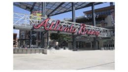 The entrance to Truist Park with a large sign stating "Atlanta Braves" over the gate