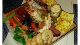 A Seacuterie (a mix of seafood and other finger foods and sauces on a board)