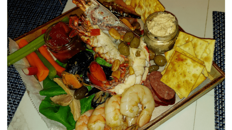 A Seacuterie (a mix of seafood and other finger foods and sauces on a board)