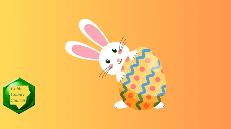 The Easter Bunny holding a painted Easter egg