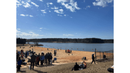 A group of people gather on the shore of Lake Acworth for the annual Polar Plunge event