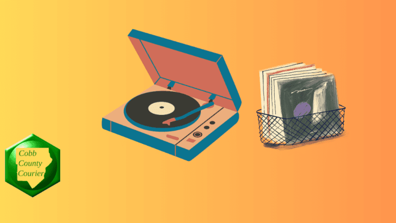 An old-fashioned record player beside a rack of vinyl records