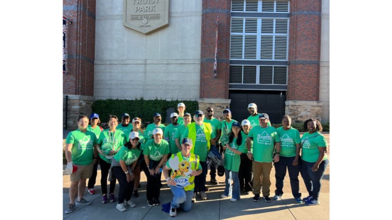 Large group photo of volunteers on Earth Day at Truist Park