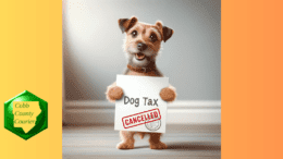 A cartoon terrier holds up a paper with Dog Tax written and a "canceled" stamp over it