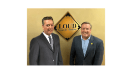 Photo of Mike Sandes and John Loud under a LOUD Security Systems logo