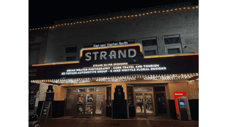The front of the Strand Theatre at night