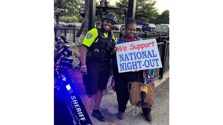 renters rights advocate Monica DeLancy with a cobb community outreach police officer